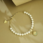 Guess Seashell Gold-Plated Pearl Women's Bracelet UBB05126YGL